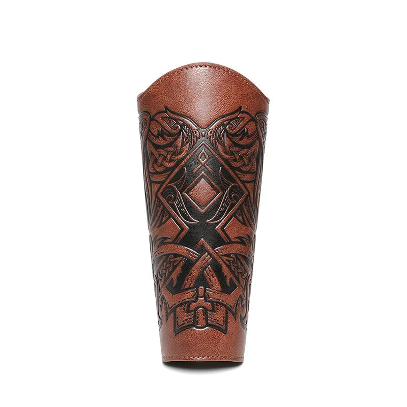 Brown leather arm guard with intricate black Viking-inspired pattern, isolated on white