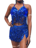 Woman wearing a blue sequin fringe halter crop top and matching mini skirt set