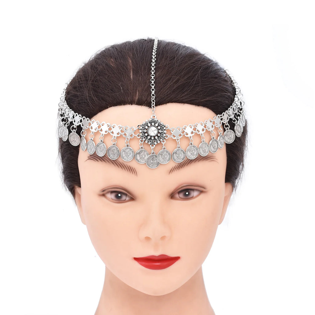 Silver coin headpiece with central floral pendant on mannequin head, boho hair accessory