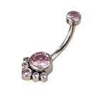 Silver belly button ring with pink gemstones arranged in a paw print shape