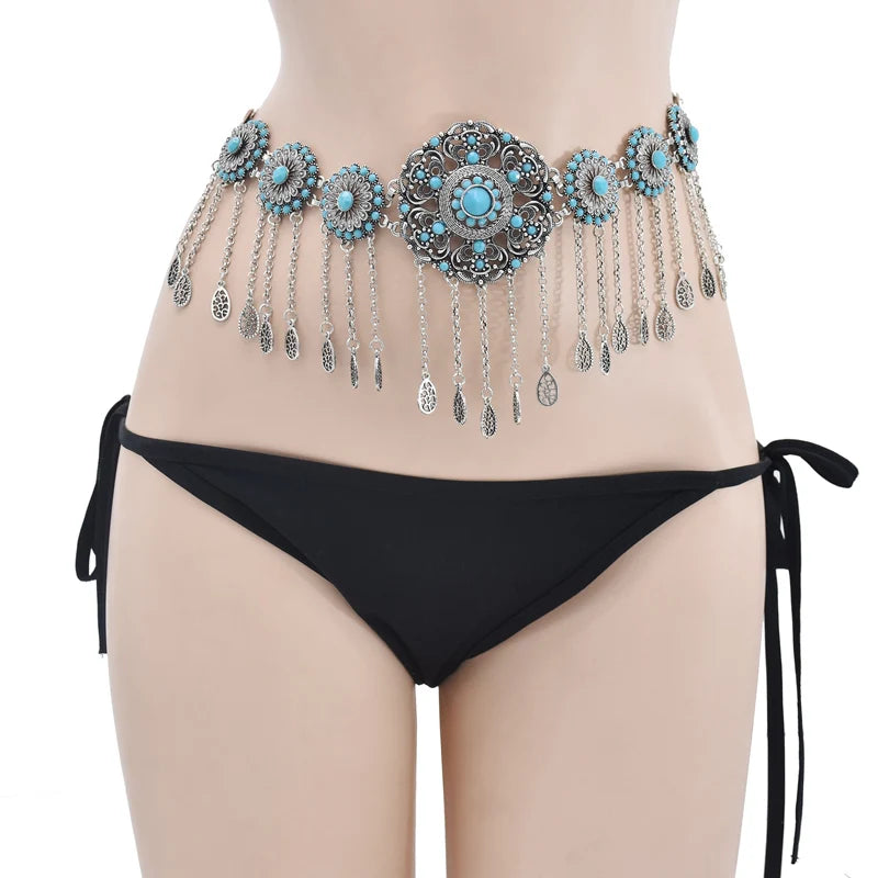 Boho turquoise belly chain with dangling charms on model wearing black bikini bottom