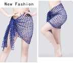 Woman modeling a blue beaded mesh beach cover up skirt with tie detail.