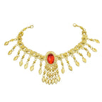 Gold statement necklace with red gemstone centerpiece and dangling gold leaf charms