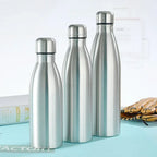 Three stainless steel insulated water bottles on a blue surface, home and outdoor use