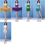 Woman modeling sequin fringe dance costumes in gold, purple, green, sky blue, and silver.