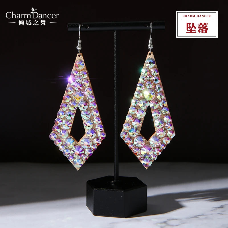 Iridescent crystal geometric drop earrings with diamond shape on black display stand