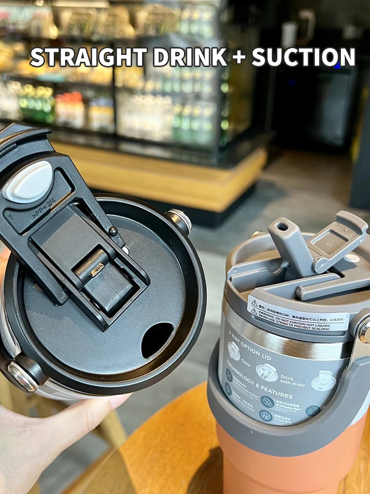 Dual-function travel tumbler cup lid with straight drink and suction options in a cafe setting