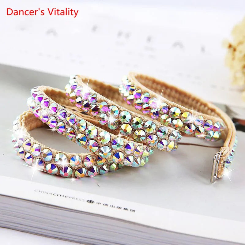 Iridescent rhinestone beaded headbands with beige fabric on a tabletop.