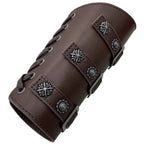 Brown faux leather wrist cuff with metal studs, decorative buckles, and lace-up design