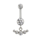 Silver belly button ring with clear cubic zirconia crystals in a crown design on white background.