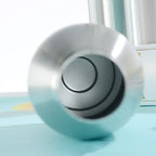 Stainless steel insulated tumbler with a close-up view of the interior on a blue surface
