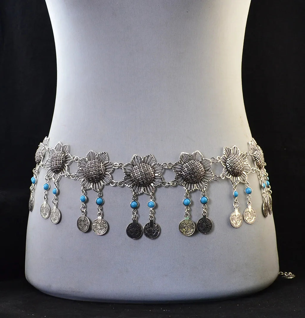 Silver boho waist belt with flower motifs, turquoise beads, and dangling coin charms