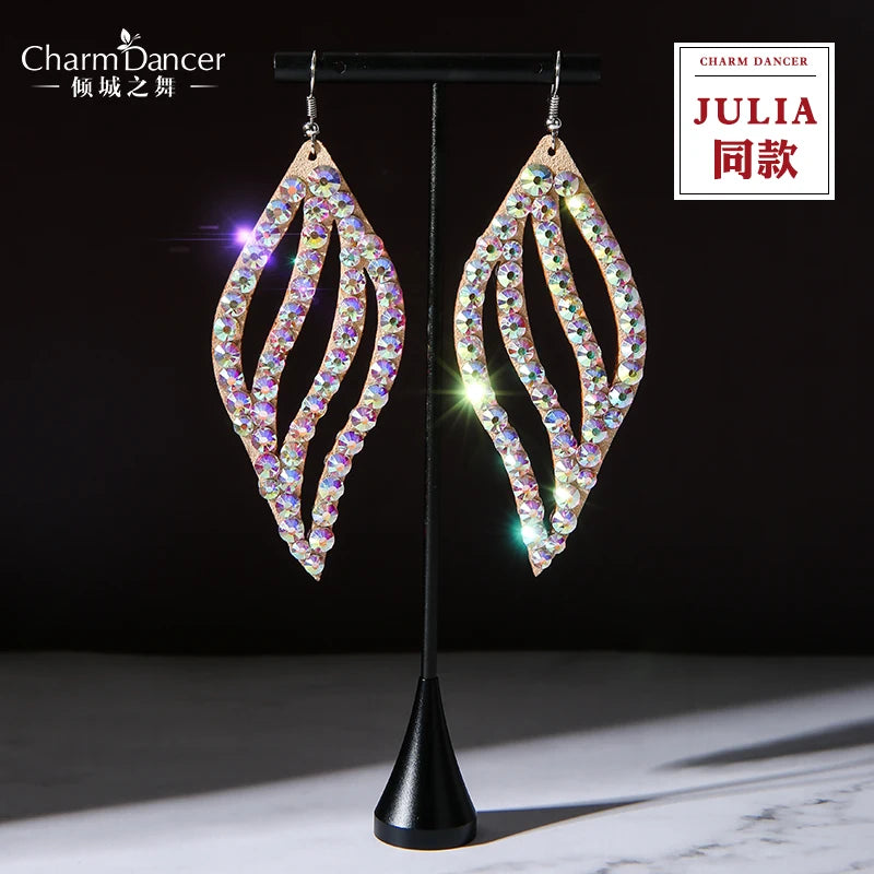 Dangling leaf-shaped earrings with sparkling rhinestones on display stand