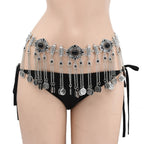 Boho silver coin belly chain with black stones, worn over black bikini bottoms