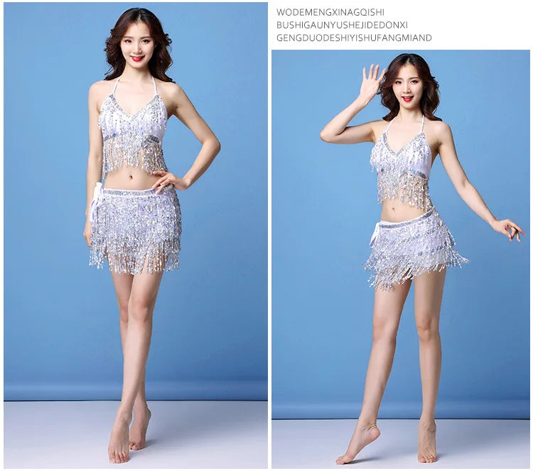 Woman modeling a silver sequin fringe dance outfit with halter top and skirt on blue background