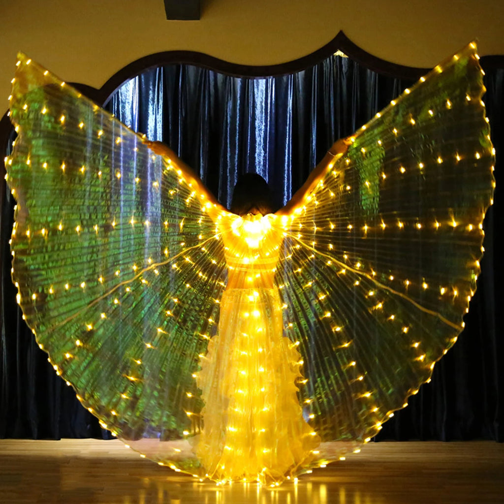Person wearing illuminated LED light up wings costume on stage with glowing yellow lights