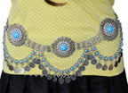 Silver coin belly chain belt with blue stones worn over yellow polka dot top