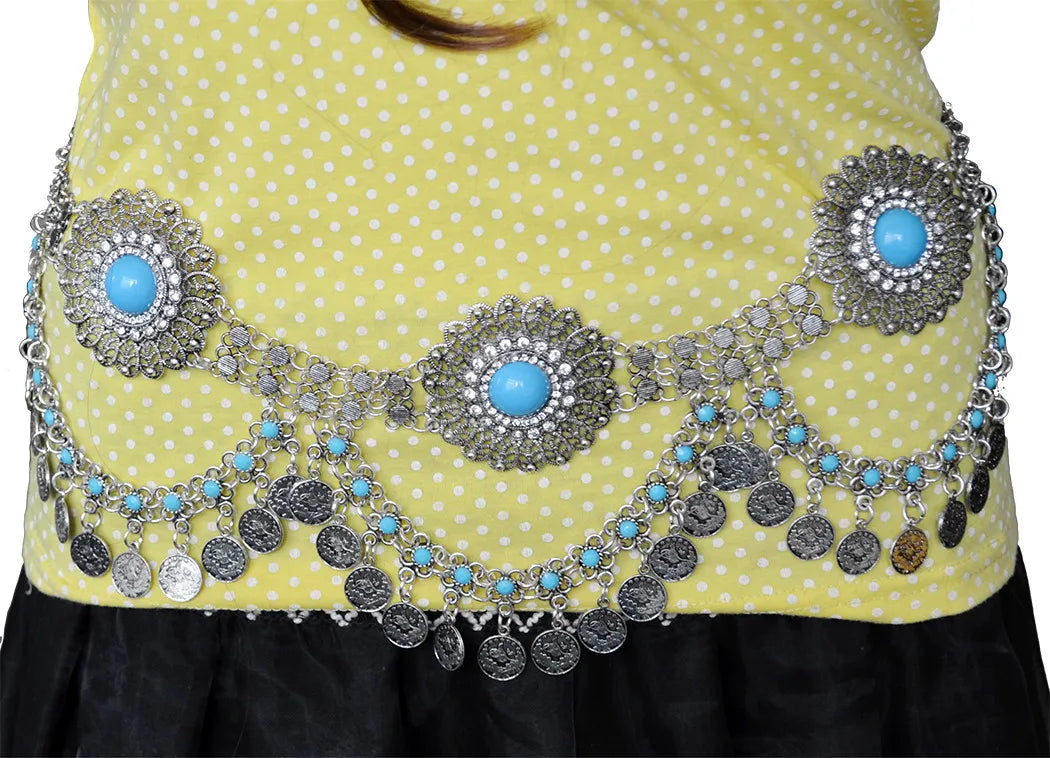 Silver coin belly chain belt with blue stones worn over yellow polka dot top