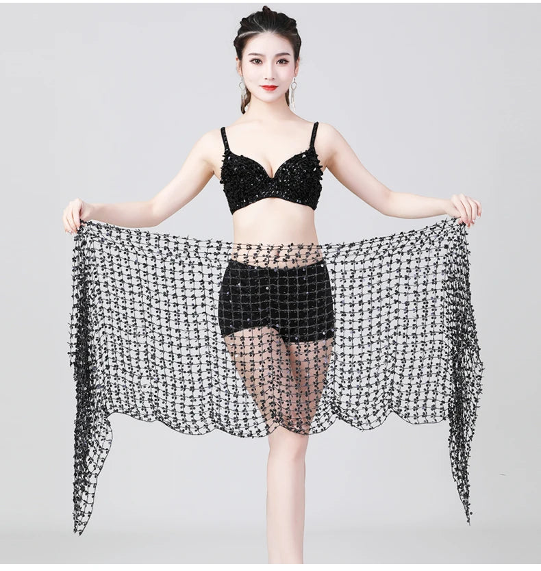 Woman modeling black sequin dance bra and shorts set with matching mesh shawl