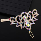 Rhinestone embellished crown tiara headband with iridescent gems on a black background