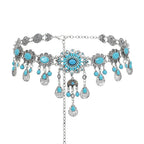 Boho silver chain belt with turquoise stones and ornate dangling charms, fashion accessory