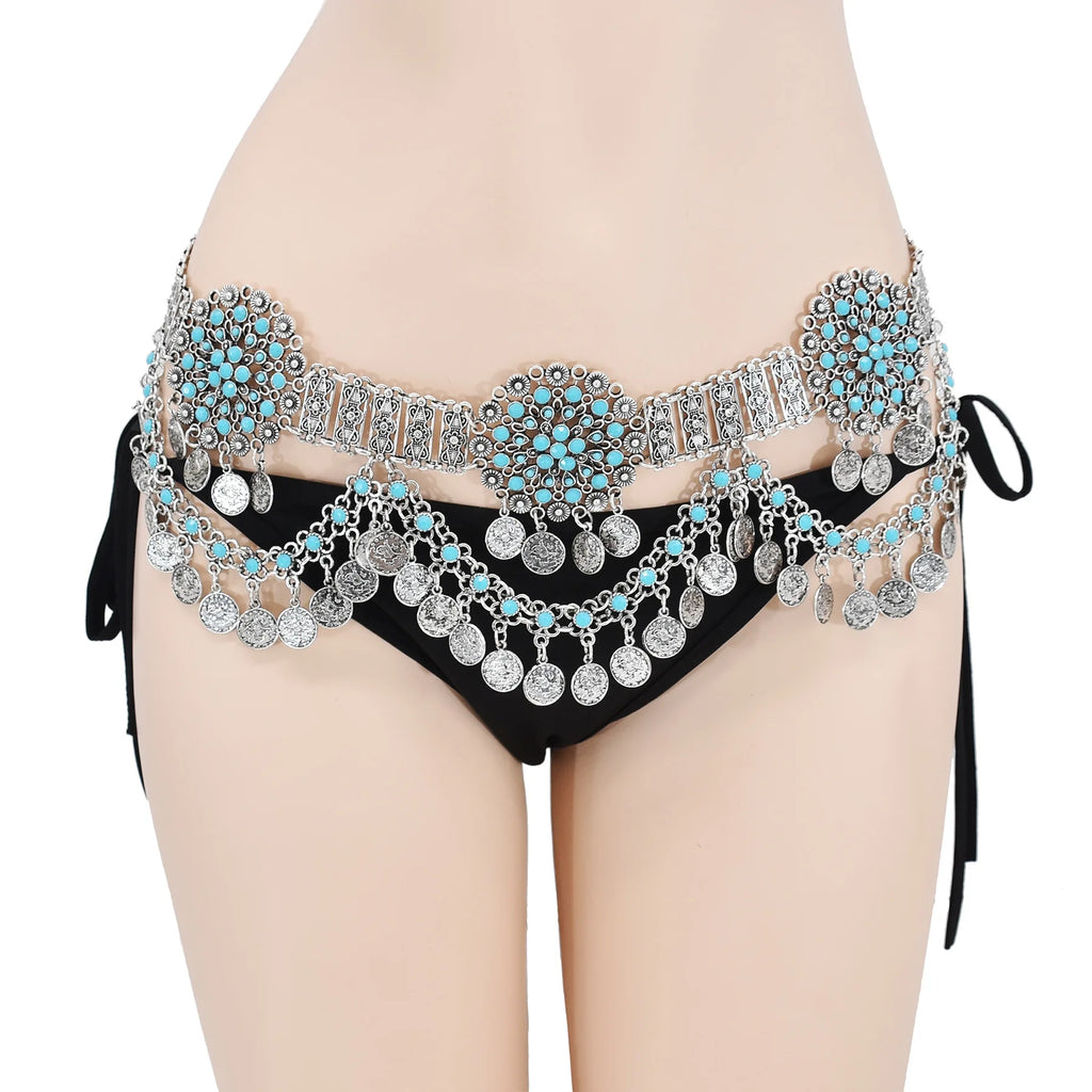 Woman wearing silver and turquoise coin belly chain over black bikini bottoms