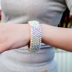 Sparkly crystal rhinestone bracelet on wrist, iridescent fashion jewelry accessory