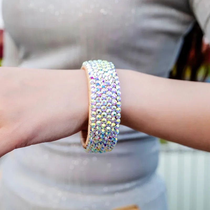 Sparkly crystal rhinestone bracelet on wrist, iridescent fashion jewelry accessory