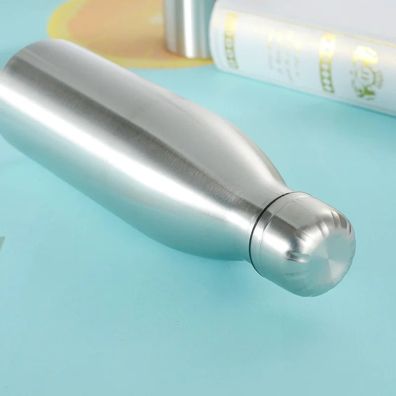 Stainless steel insulated water bottle on blue background