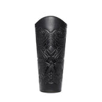 Black leather arm guard with intricate embossed Viking pattern, medieval costume accessory