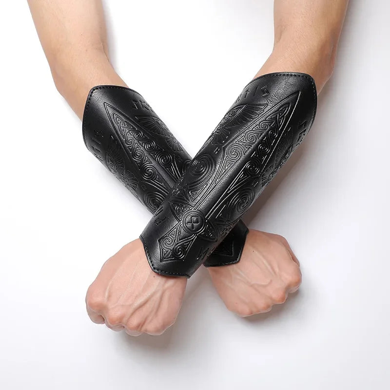 Black embossed faux leather bracers with Viking-inspired patterns on crossed wrists