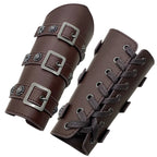 Pair of brown faux leather bracers with metal buckles and decorative studs, lace-up design