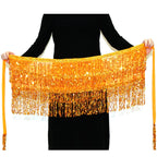 Person holding a yellow belly dance hip scarf with gold sequins and fringe beads.