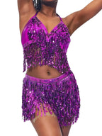 Woman wearing a purple sequin fringe halter top and matching shorts set