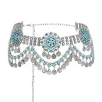 Boho silver coin belt with turquoise accents and ornate floral patterns