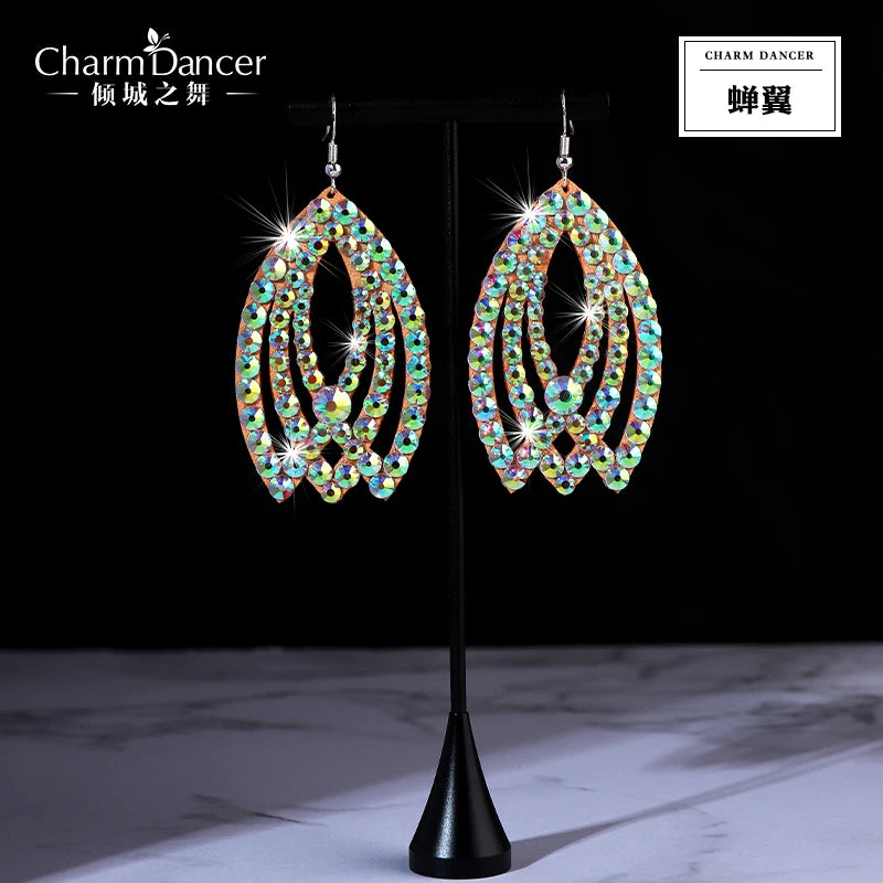 Rhinestone teardrop dangle earrings with sparkling crystals on a display stand