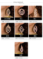 Display of six pairs of sparkling statement earrings in various geometric shapes, modeled close-up.