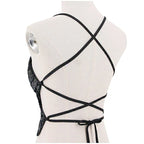 Back view of sequin halter crop top with black crisscross straps on mannequin