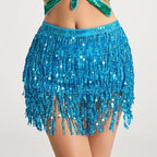 Woman wearing a blue sequin fringe mini skirt with shimmering tassels, party fashion