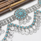 Boho silver coin necklace and bracelet set with turquoise beads on white background