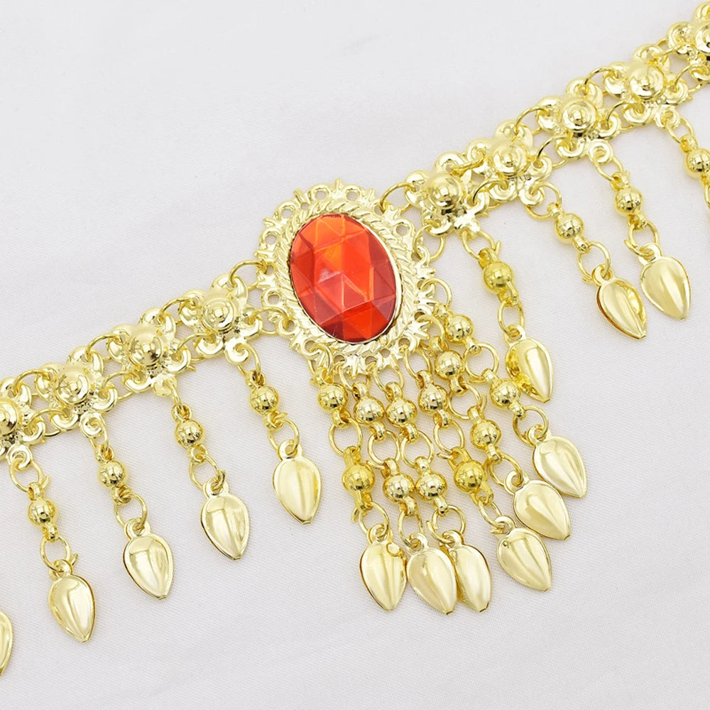 Gold decorative chain belt with dangling teardrop charms and red gemstone accent
