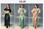 Three women modeling sequin belly dance costumes in green, blue, and gold with ruffled skirts.