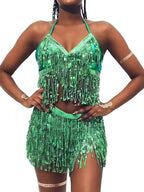 Woman wearing green sequin fringe halter crop top and matching shorts set