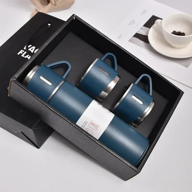 Blue insulated travel flask and two matching cups in a gift box, ideal for outdoor use