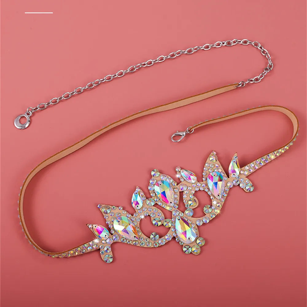 Rhinestone tiara headband with gold strap and chain on pink background