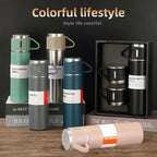 Colorful 500ml vacuum insulated bottles and mugs on display with modern home decor style.