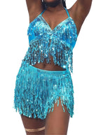 Woman wearing a blue sequin fringe crop top and matching shorts, festival dance outfit