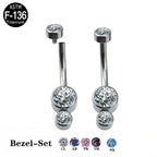 Titanium bezel-set belly button rings with clear and colored crystal options