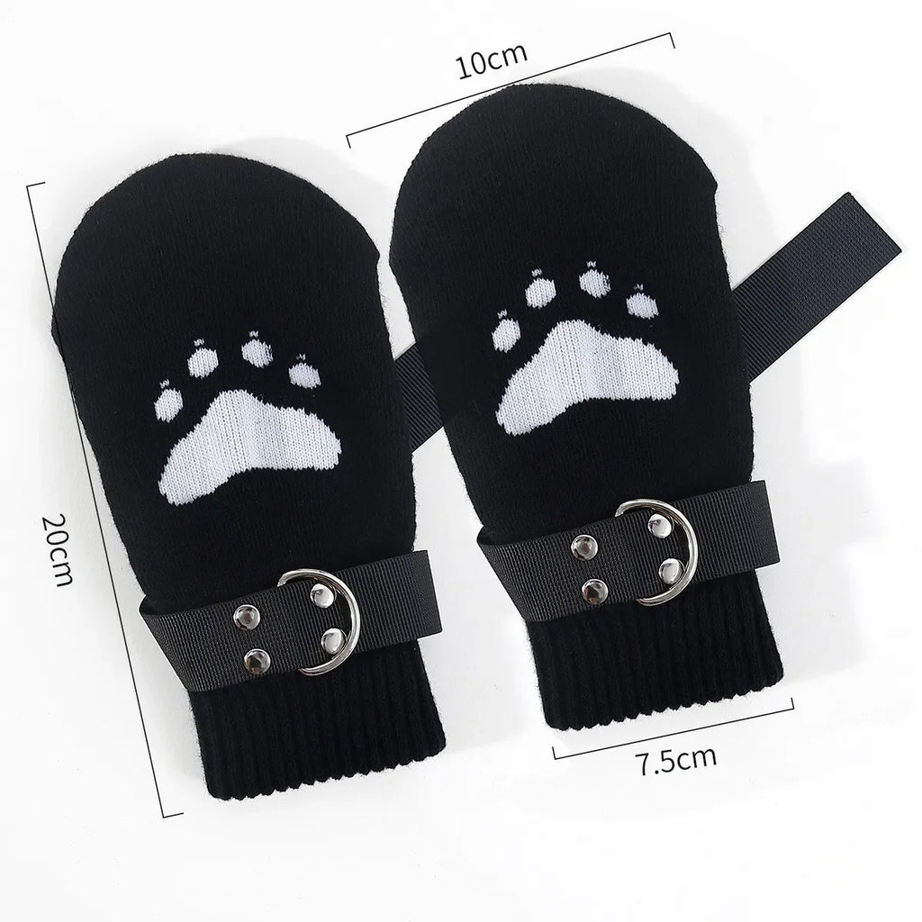 Black mittens with white paw print, adjustable straps, and visible size measurements
