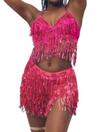 Woman wearing a pink fringe sequin crop top and skirt dance set